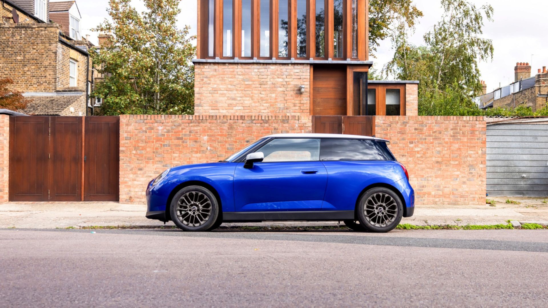 All- electric MINI Cooper driving down the road 
